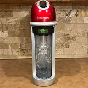SodaStream metallic Red and Silver Sparkling Water Maker with bottle